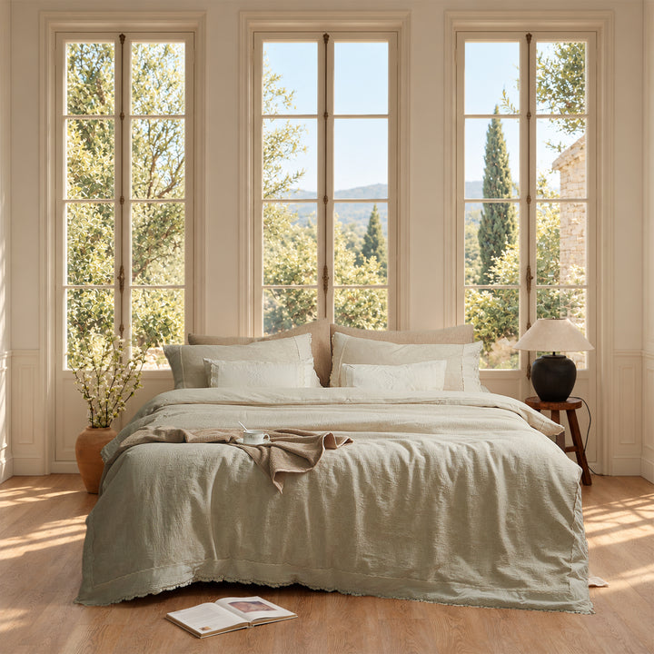 DAUAOTO warm beige cotton-linen jacquard duvet cover set with delicate floral lace, styled in a sunlit bedroom.