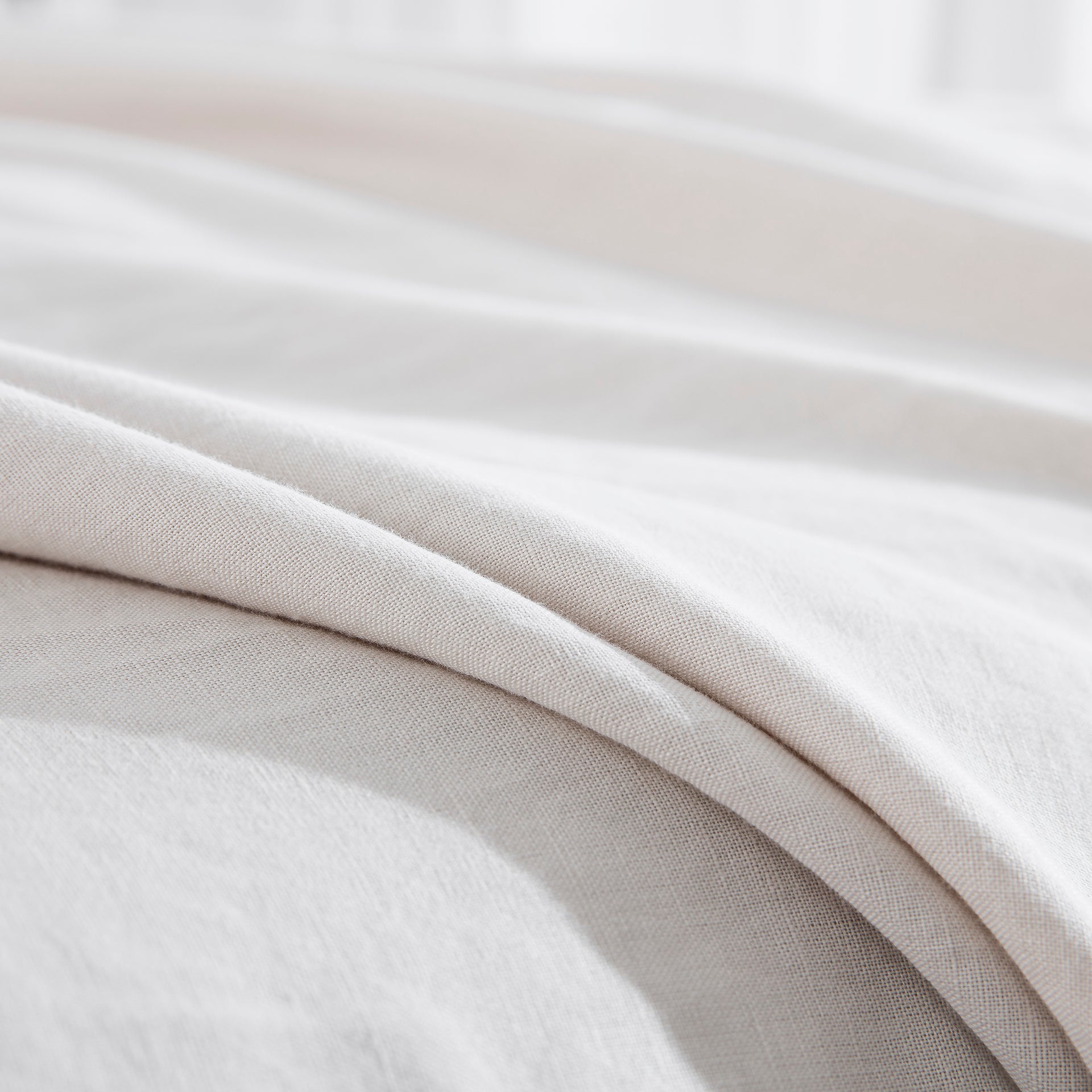 Close-up of the premium 55% European flax linen and 45% natural cotton blend fabric in light grey - DAUAOTO