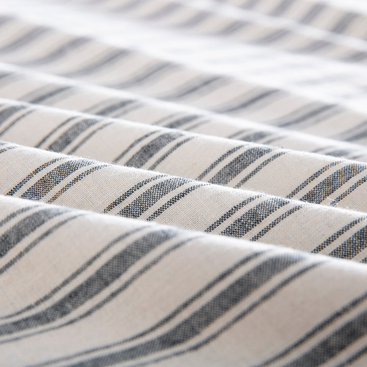 Close-up of the tactile lived-in texture and exceptional color depth of the yarn-dyed classic grey striped fabric - DAUAOTO