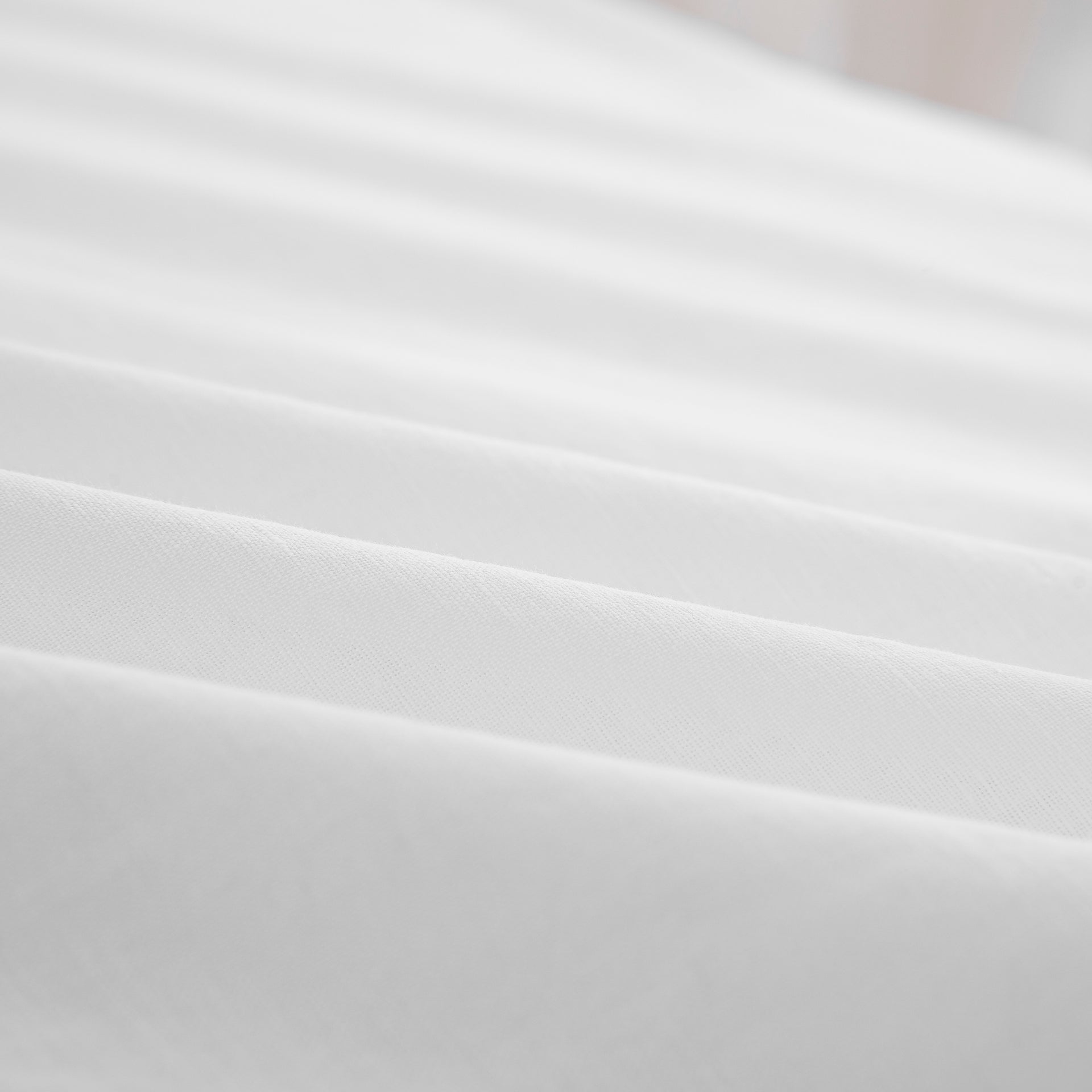 Close-up of the highly breathable 55% European flax linen and 45% natural cotton blend fabric in crisp white - DAUAOTO