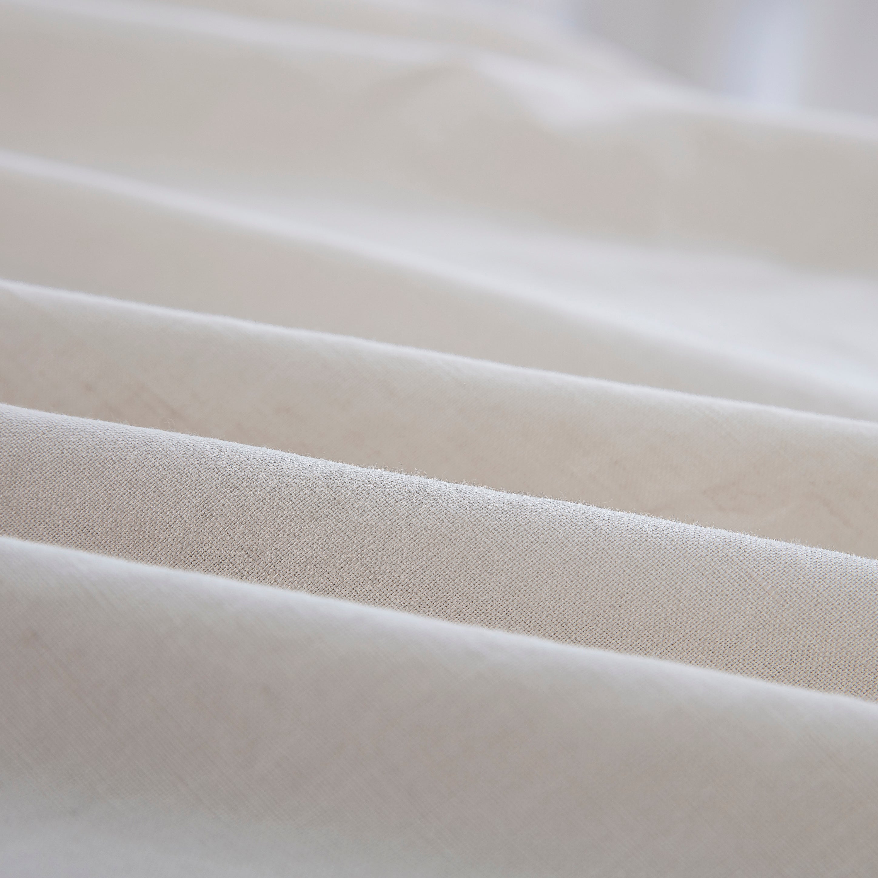 Close-up of the highly breathable 55% European flax linen and 45% natural cotton blend fabric in an earthy oatmeal hue - DAUAOTO
