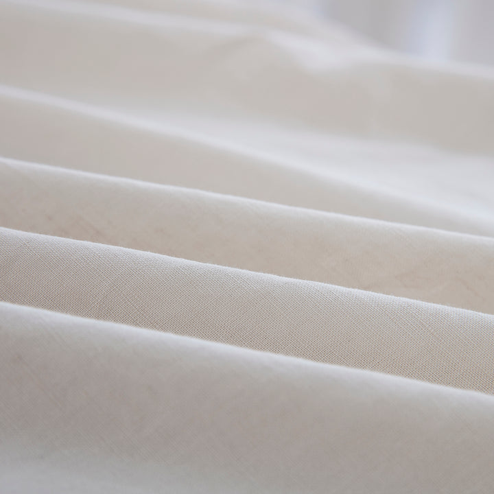 Close-up of the highly breathable 55% European flax linen and 45% natural cotton blend fabric in an earthy oatmeal hue - DAUAOTO