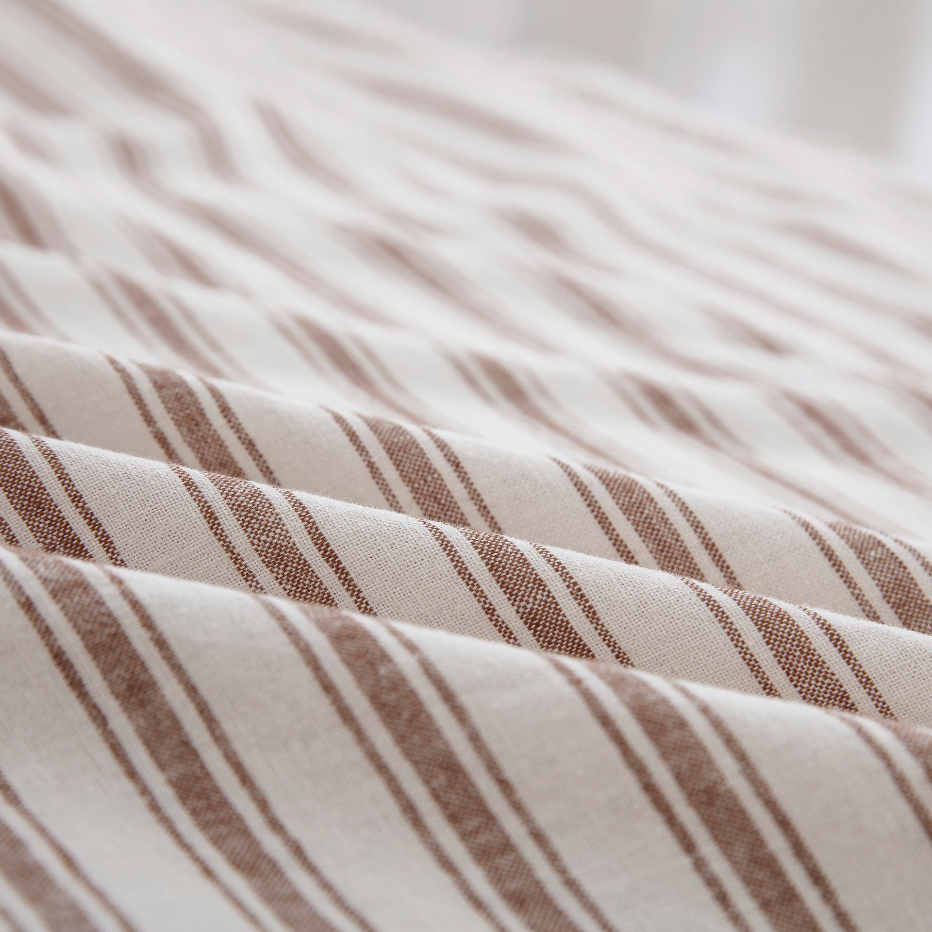 Close-up of the tactile lived-in texture and exceptional color depth of the yarn-dyed taupe striped sheet fabric - DAUAOTO
