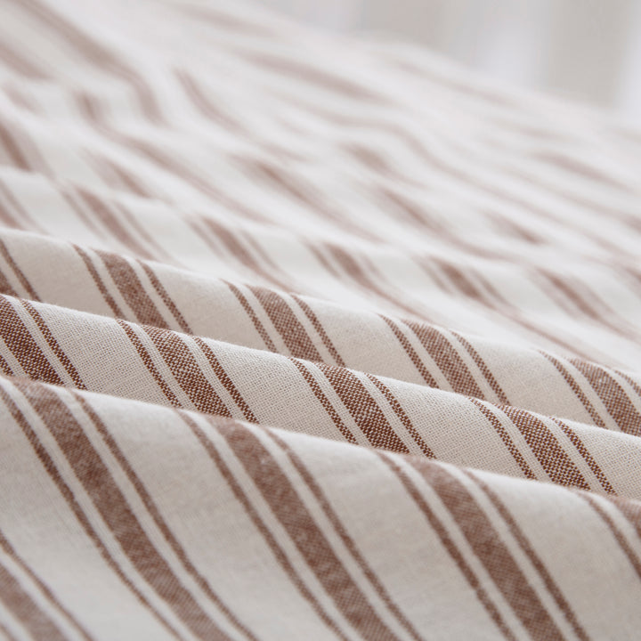 Close-up of the tactile lived-in texture and exceptional color depth of the yarn-dyed taupe striped sheet fabric - DAUAOTO