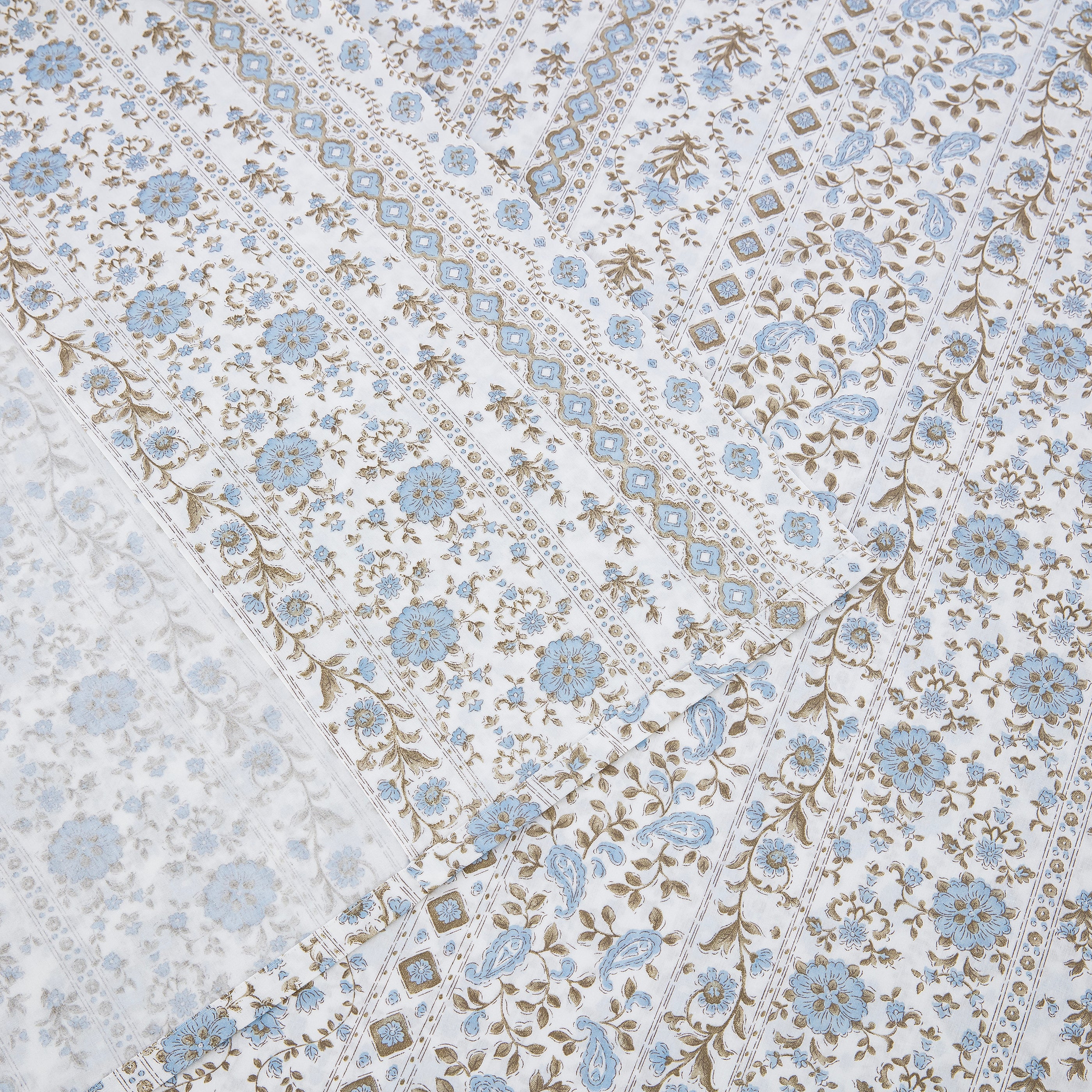 Detailed view of the intricate border pattern and neat hem on the DAUAOTO coastal blue block print lightweight cotton flat sheet.