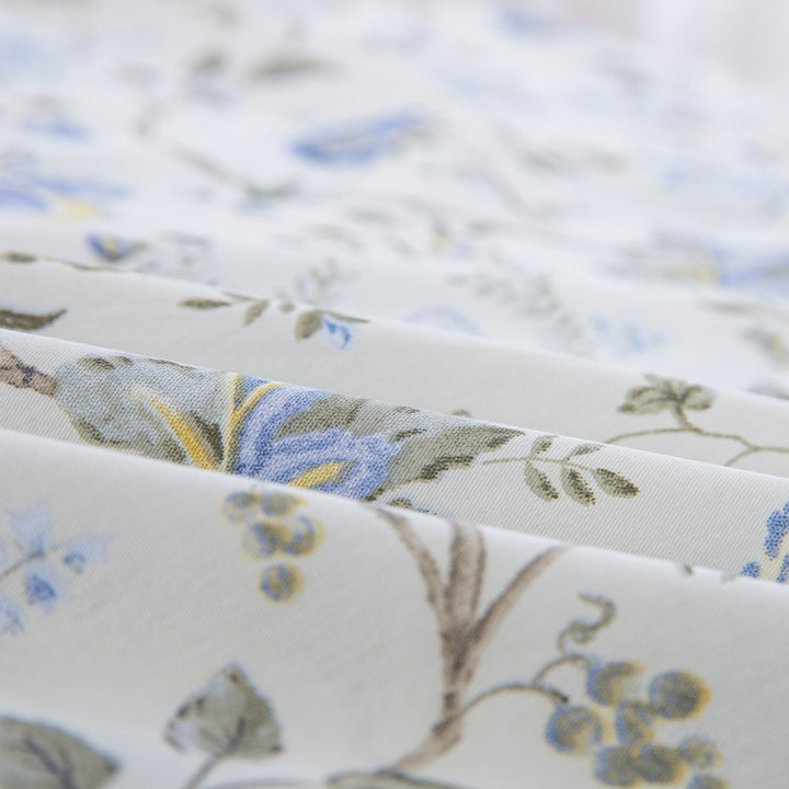 Folded DAUAOTO Provence blue botanical cotton bed sheets highlighting the smooth, breathable, and lightweight fabric texture.