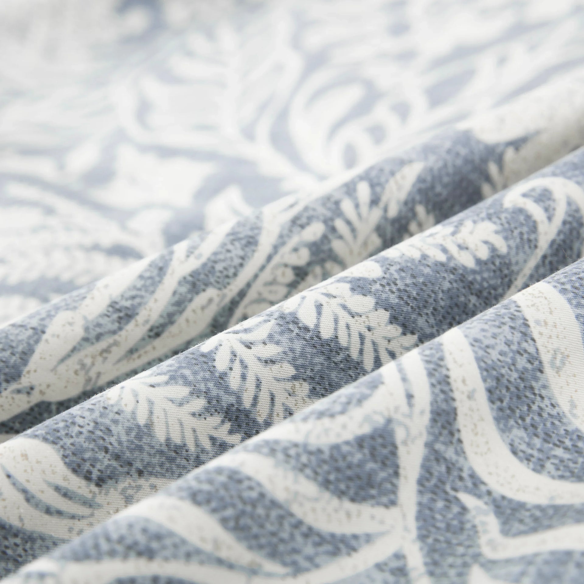Close-up of the ultra-soft 100% pure cotton fabric showing the bluish-gray and soft white botanical print - DAUAOTO