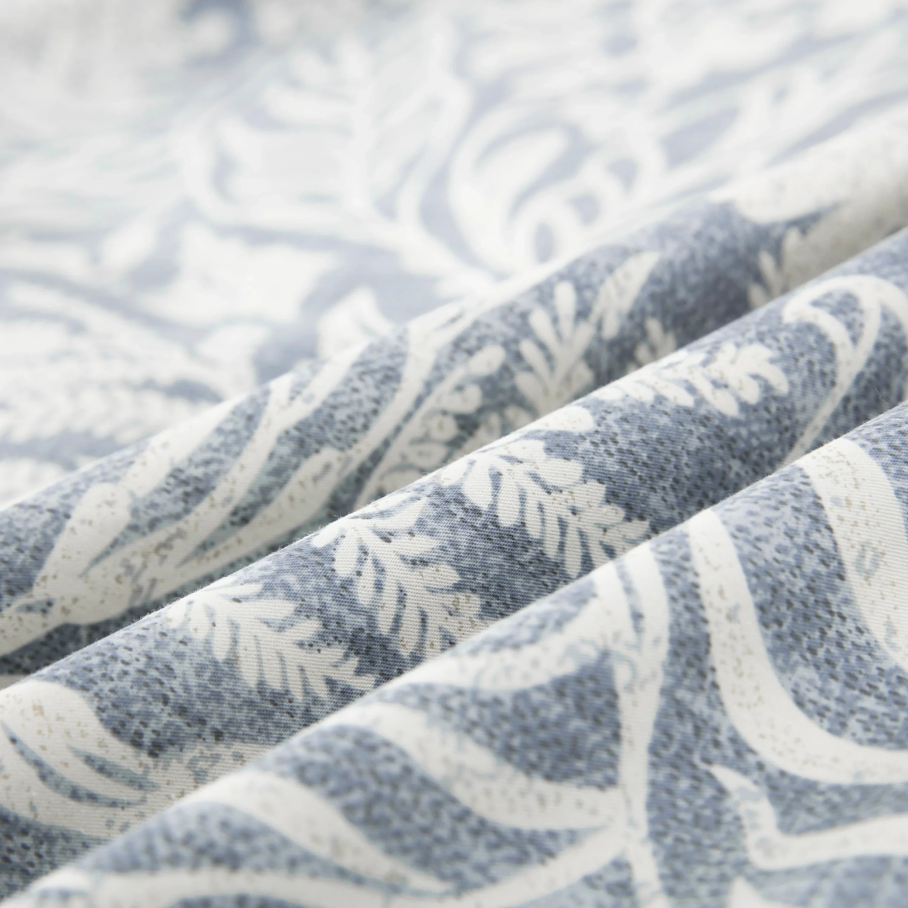 Close-up of the ultra-soft 100% pure cotton fabric showing the bluish-gray and soft white botanical print - DAUAOTO