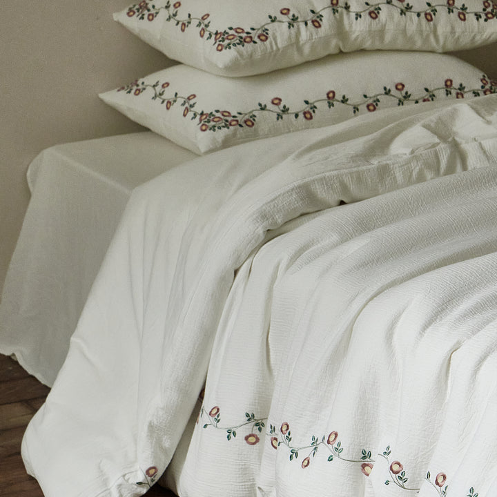 Briar Bloom washed cotton duvet cover featuring embroidered floral border details