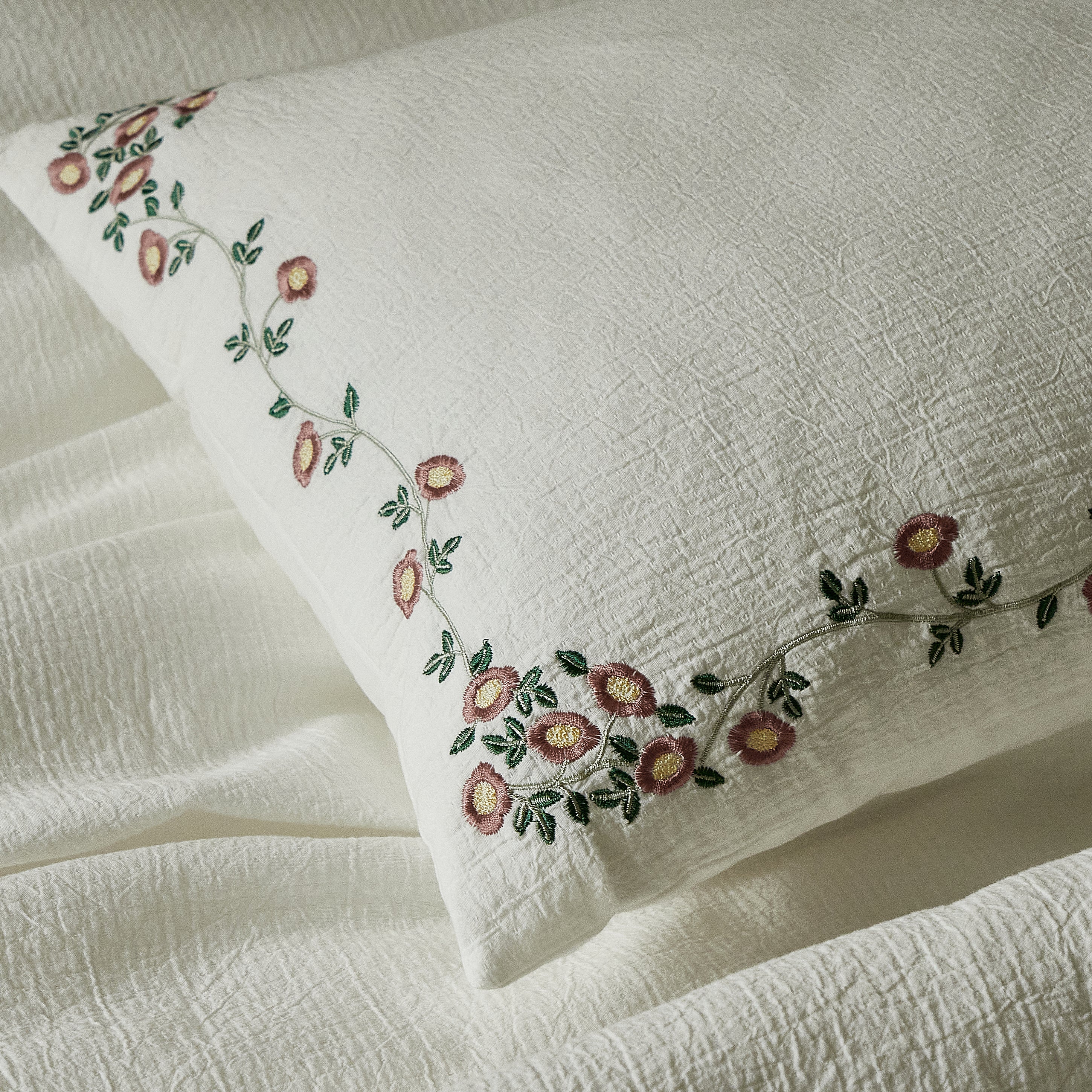 Briar Bloom soft ivory pillow sham with delicate floral vine embroidery