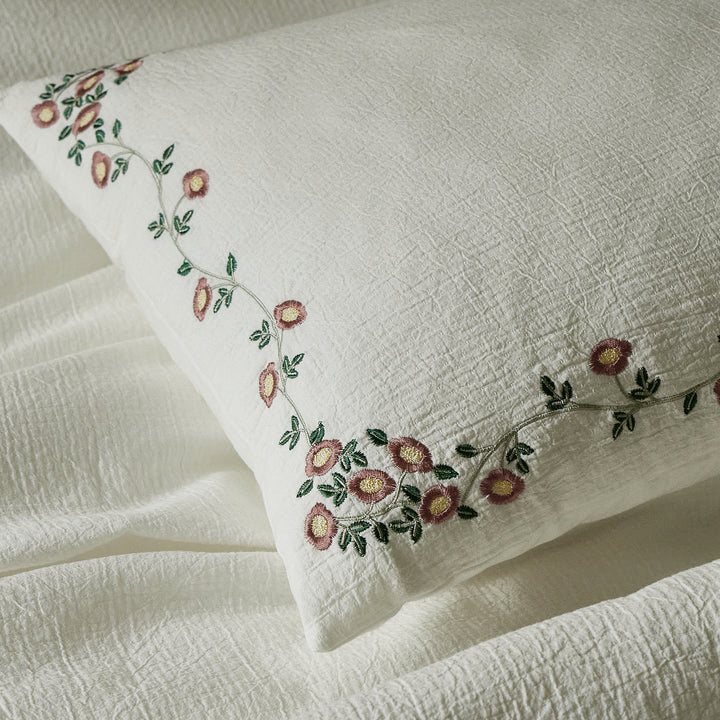 Briar Bloom soft ivory pillow sham with delicate floral vine embroidery