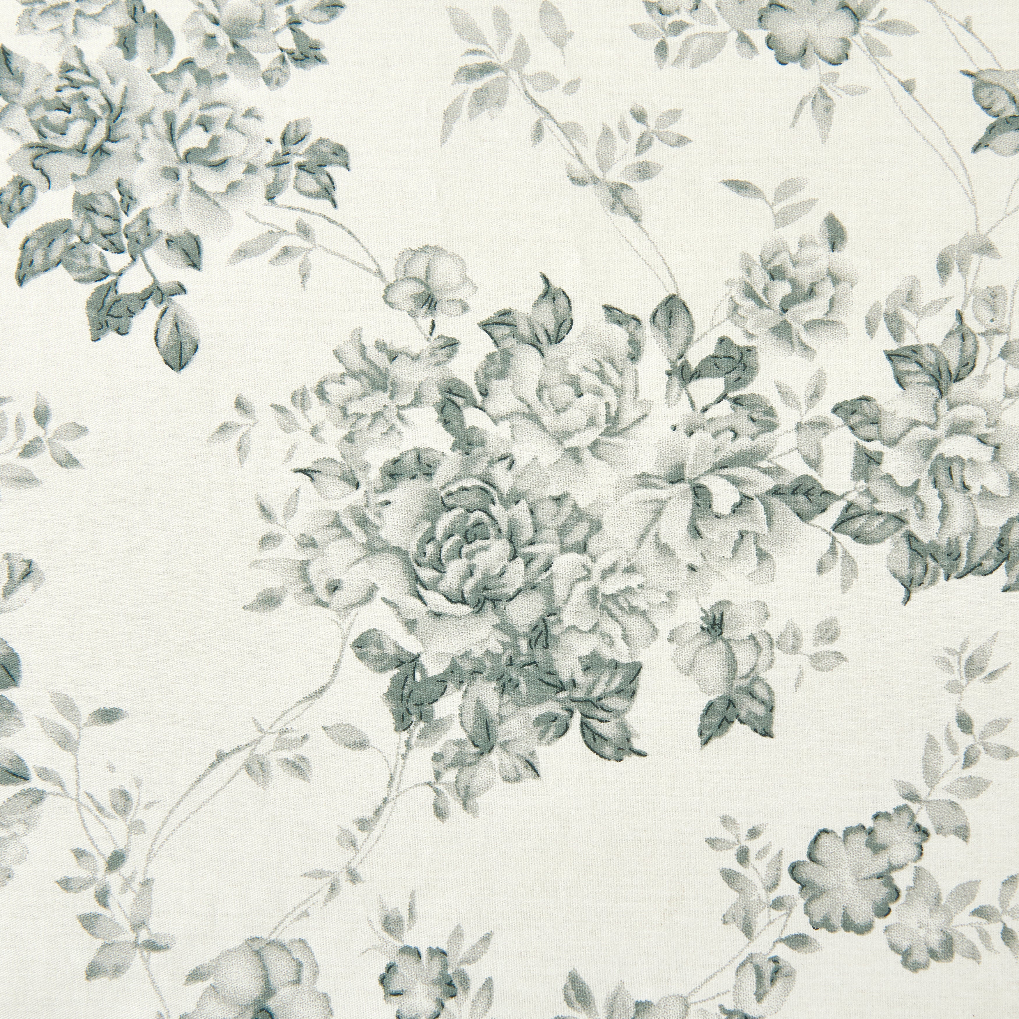 Close-up of the traditional pale black rose pattern delicately printed on crisp light ground cotton fabric - DAUAOTO