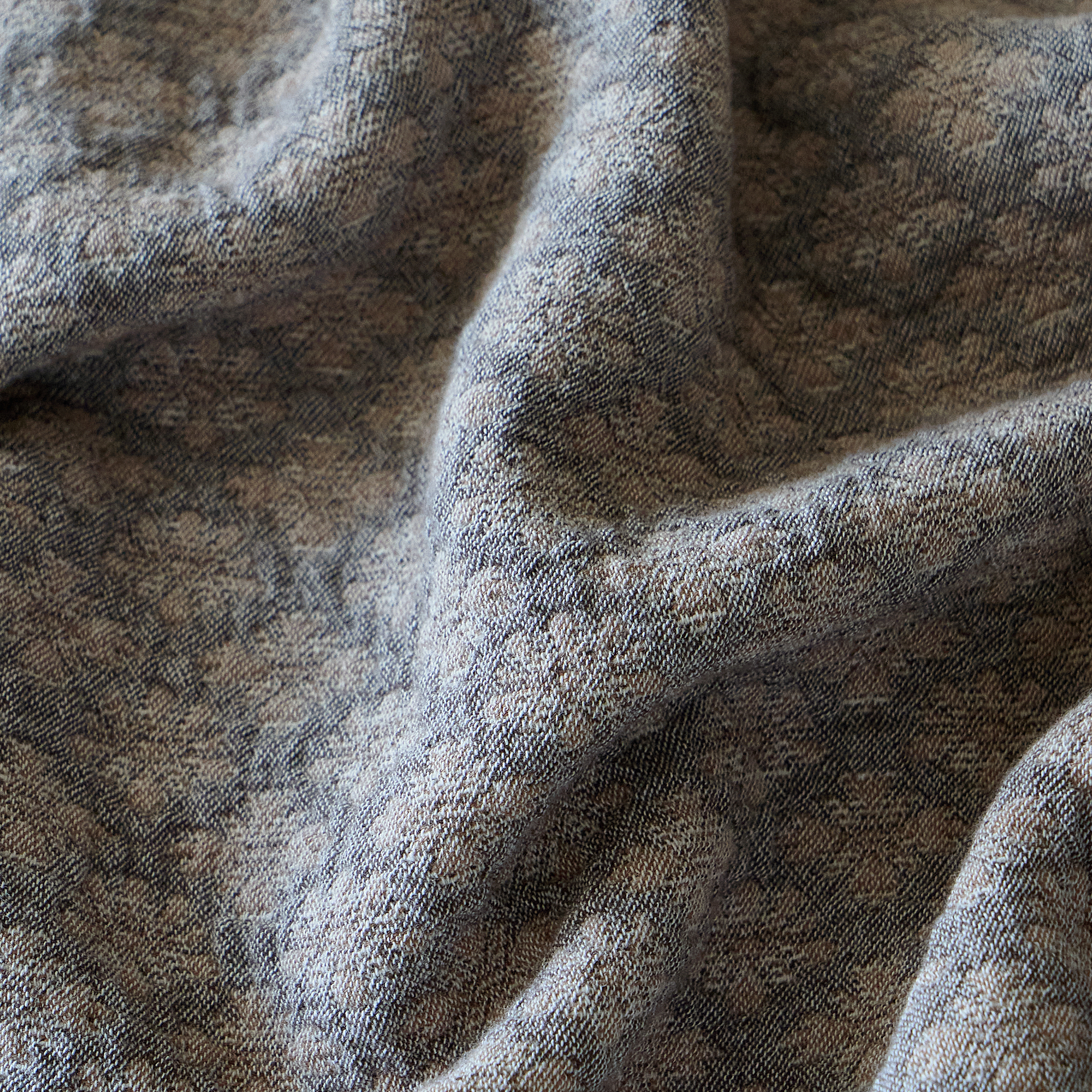 Close-up of the charcoal gray 3D yarn-dyed diamond jacquard fabric showing its heavyweight washed texture.