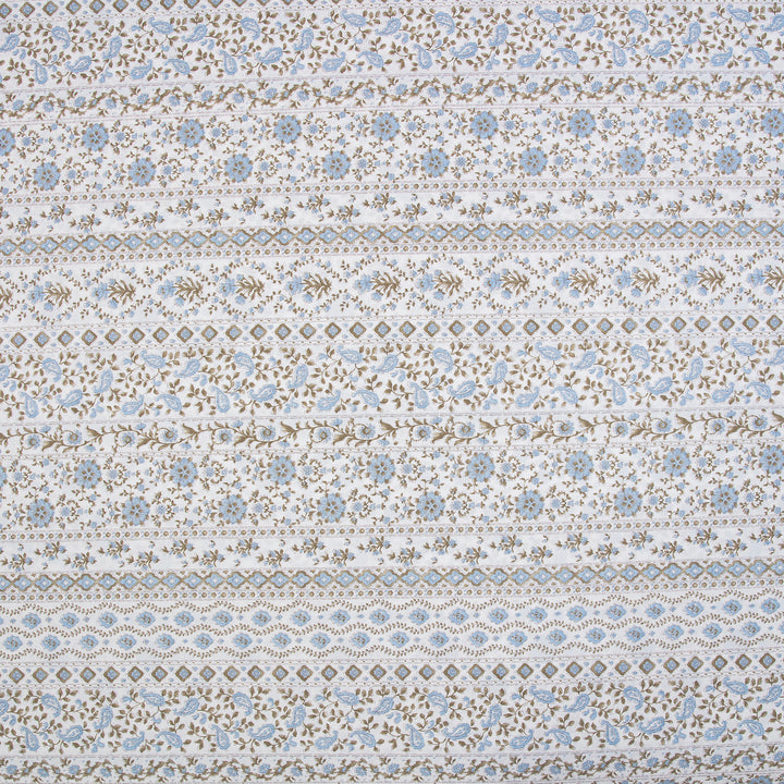Close-up of DAUAOTO lightweight cotton fabric featuring a serene coastal blue and sand block print floral pattern.