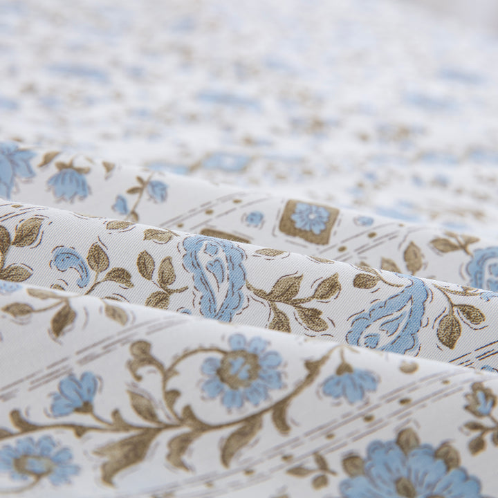 Folded DAUAOTO coastal blue block print cotton bed sheets highlighting the breathable, smooth, and lightweight fabric texture.