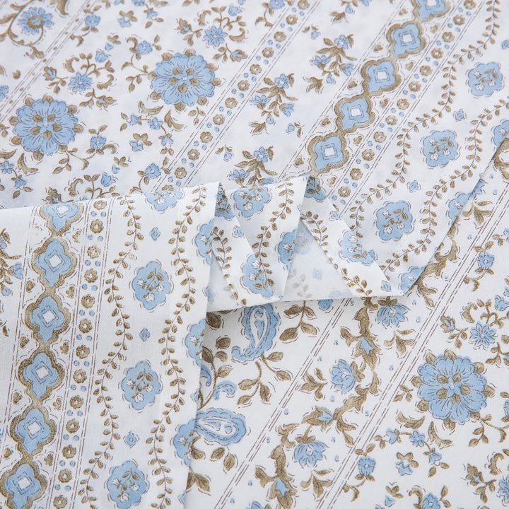 Close-up showing the elegant folded edges of the DAUAOTO coastal blue botanical block print cotton sheets.