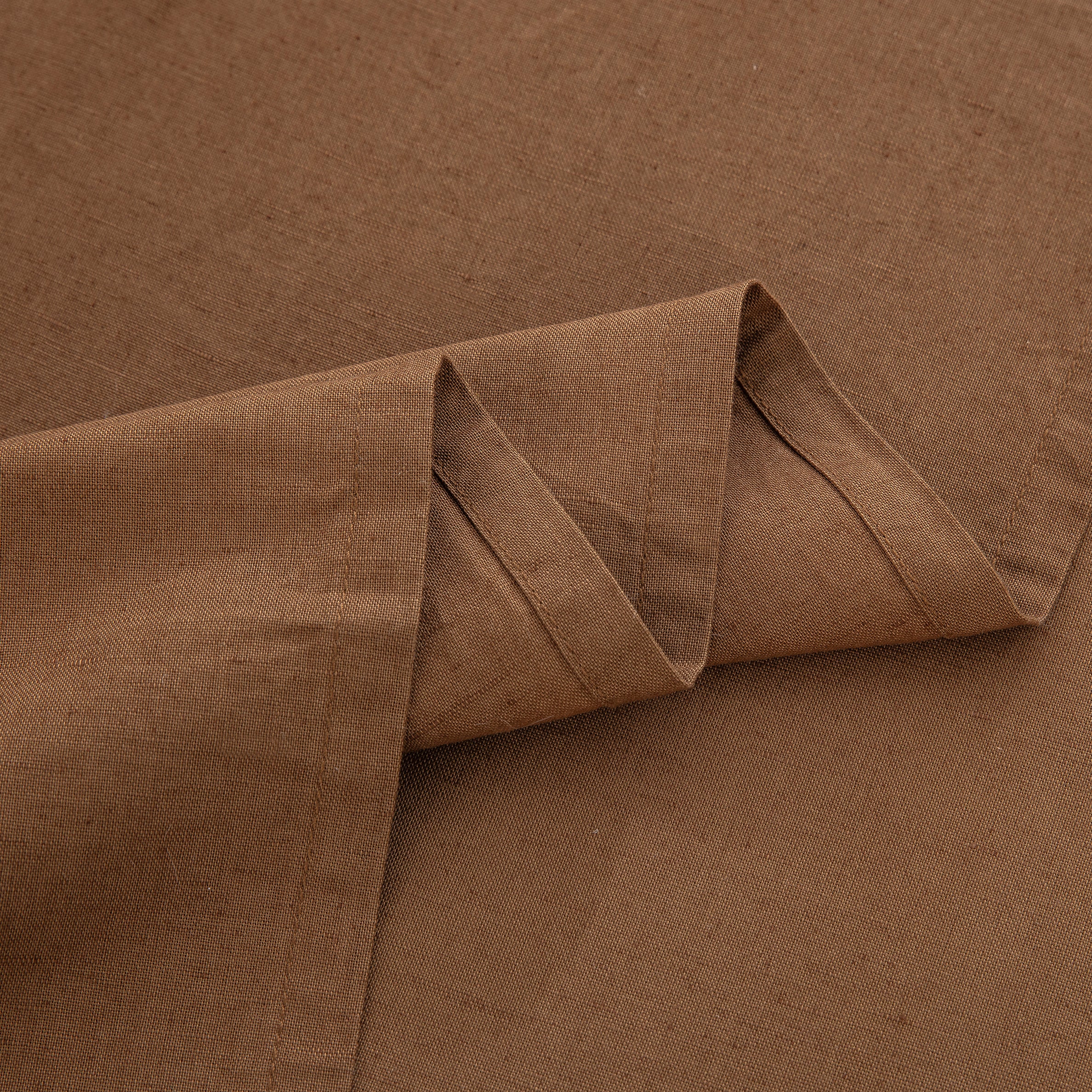 Detailed view of the prewashed cognac brown flat sheet highlighting the beautifully textured finish and smooth softness - DAUAOTO