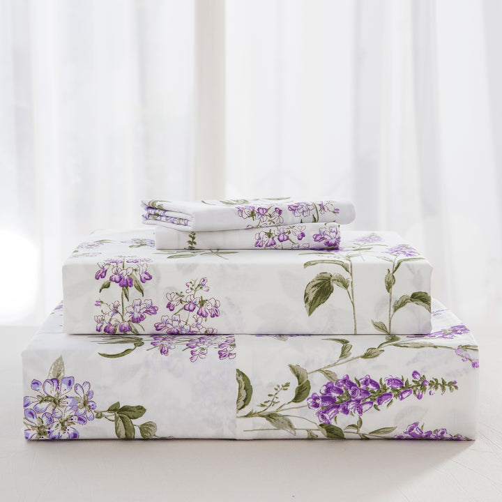 Complete pure cotton bedding ensemble neatly folded including a beautifully draped flat sheet, tailored fitted sheet, and matching pillowcases - DAUAOTO