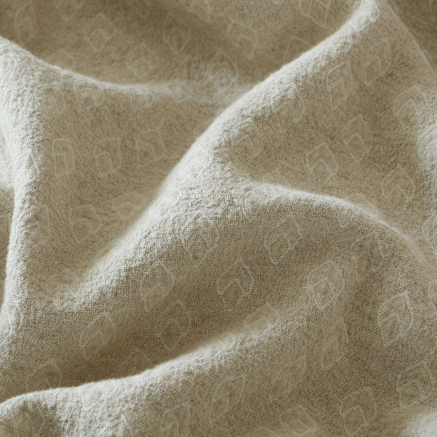 Close-up of the breathable cotton-linen blend fabric showing the woven geometric jacquard texture.