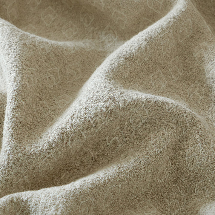 Close-up of the breathable cotton-linen blend fabric showing the woven geometric jacquard texture.
