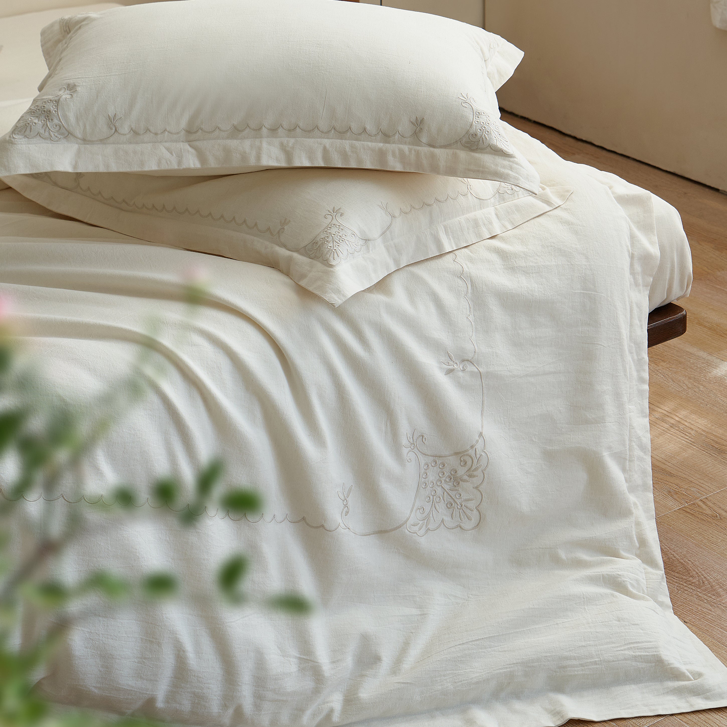 Aveline linen-cotton duvet cover and matching pillow shams showing their soft texture and relaxed drape.