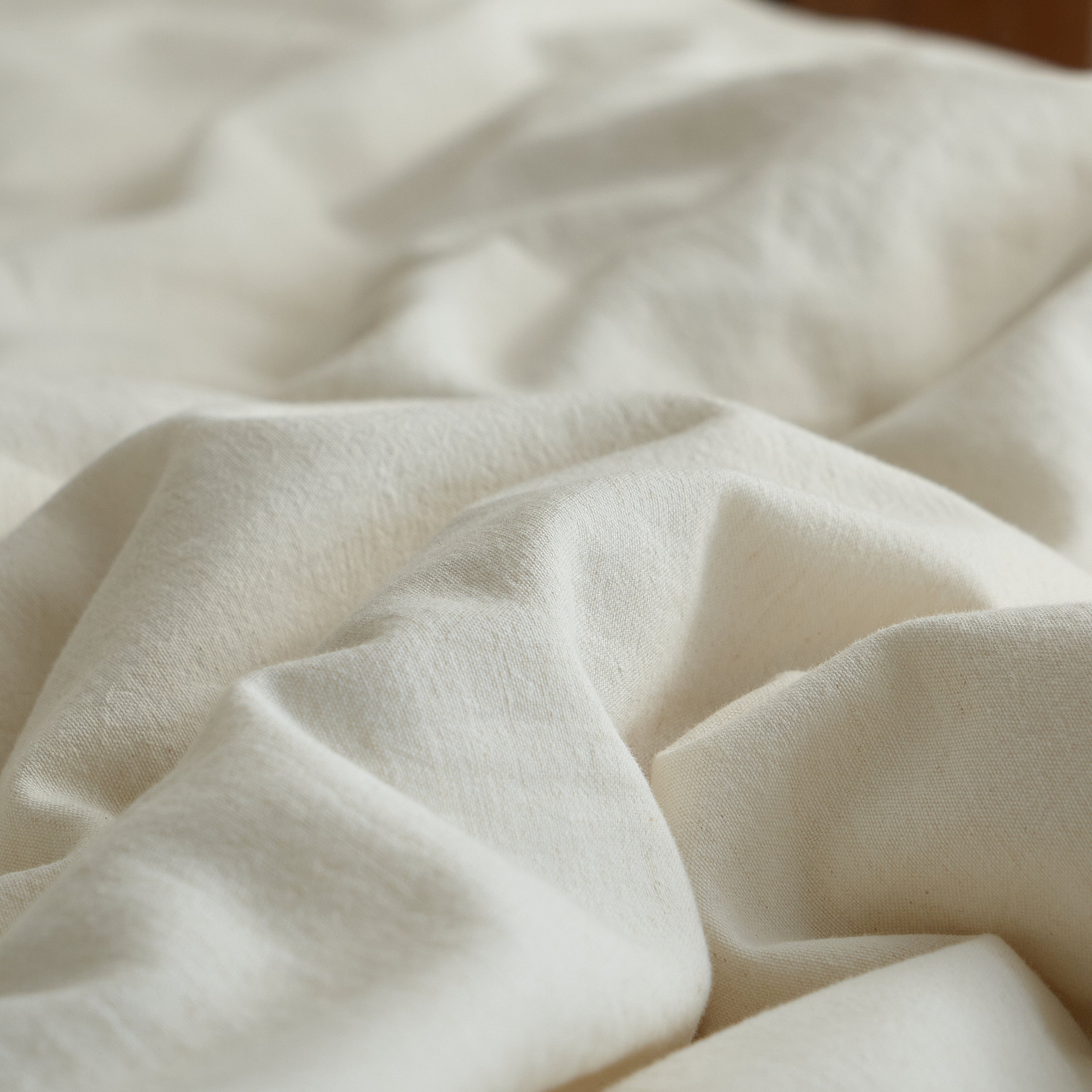 Close-up of the soft, naturally textured linen-cotton fabric used in the Aveline duvet cover set.