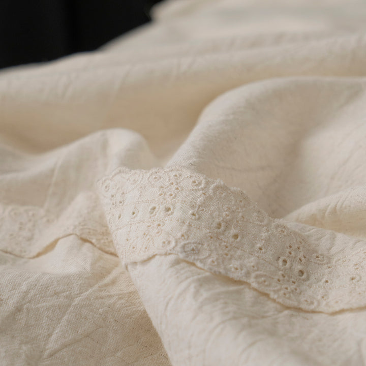 Close-up of the 65% cotton and 35% linen blend fabric, showing its natural wabi-sabi crinkled texture.