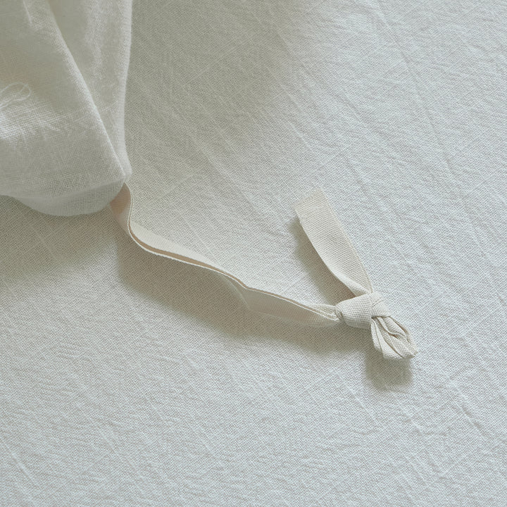 Interior corner tie on the Morning Meadow duvet cover designed to help keep the duvet insert in place.