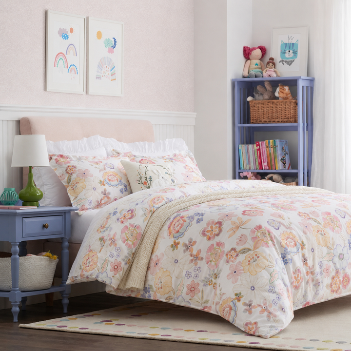 DAUAOTO pastel blossom watercolor floral duvet cover set in a cheerful and bright bedroom with a blue nightstand.