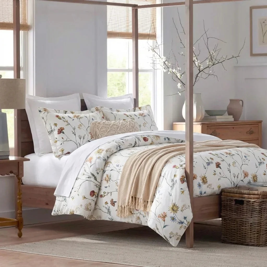 Bright French country bedroom featuring the Wildflower Garden 100% cotton duvet cover set on a four-poster bed - DAUAOTO