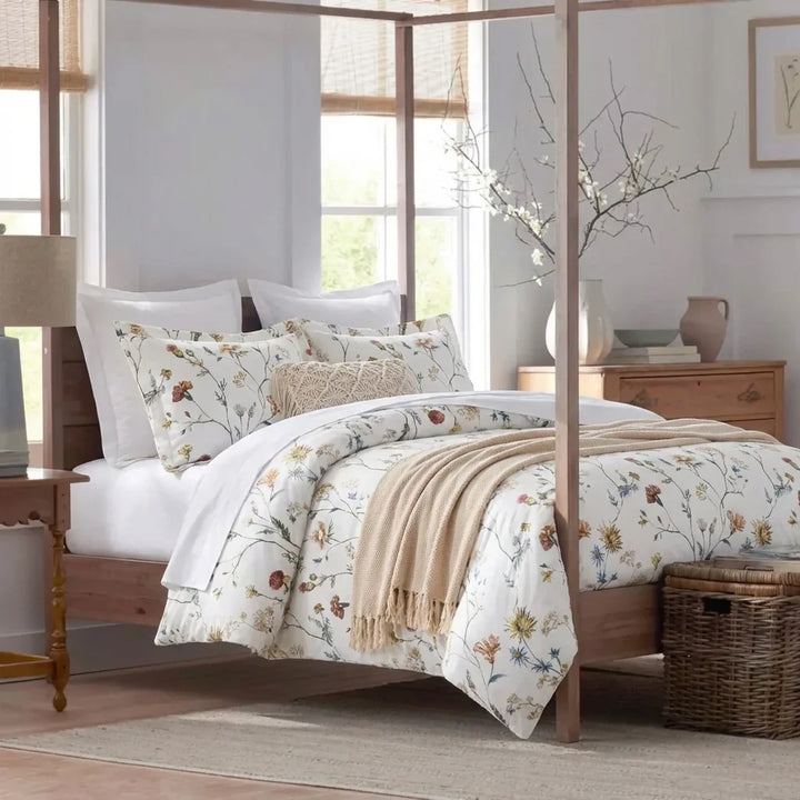 Bright French country bedroom featuring the Wildflower Garden 100% cotton duvet cover set on a four-poster bed - DAUAOTO