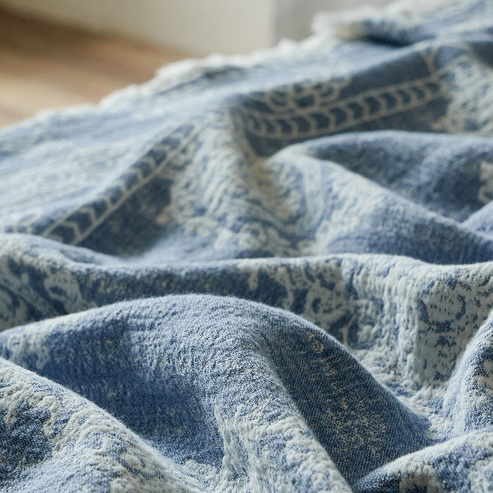 Close-up of the breathable dusty blue linen blend fabric showing the natural crinkle texture.