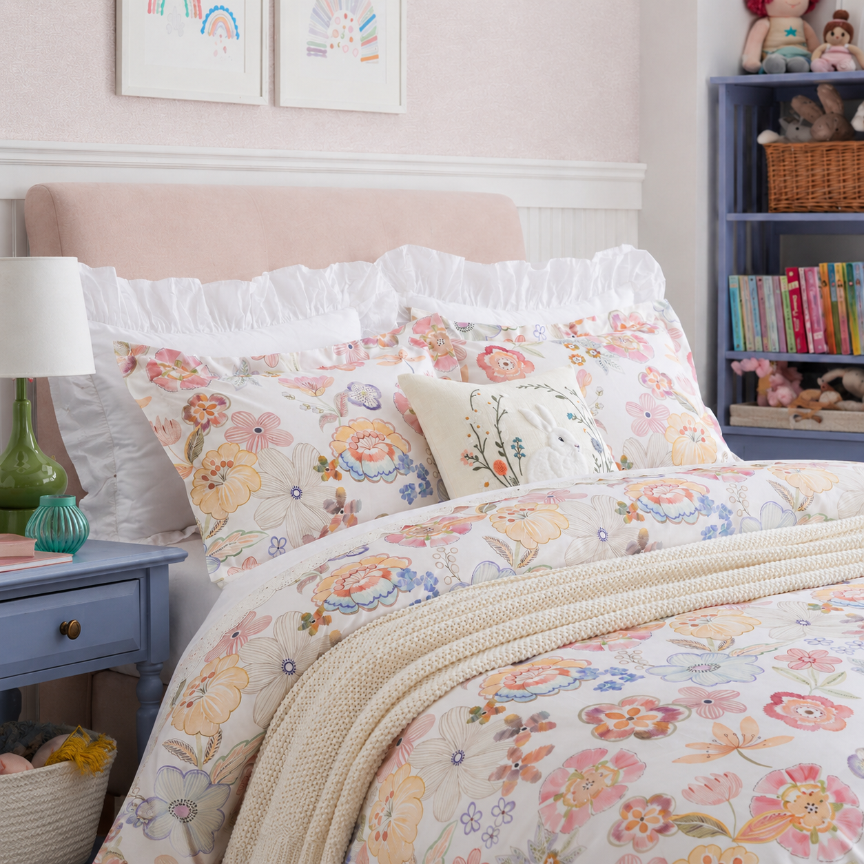 Close-up of the DAUAOTO pastel blossom floral pillowcases neatly arranged on a bed next to a blue nightstand.