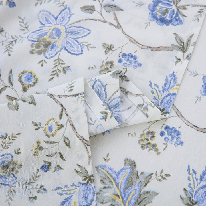 Close-up showing the elegant folded edges and vibrant print of the DAUAOTO French country blue botanical cotton sheets.