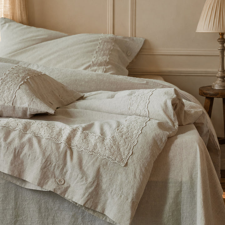 Side view of the DAUAOTO Provence embroidered lace bedding set showing the natural drape and texture.