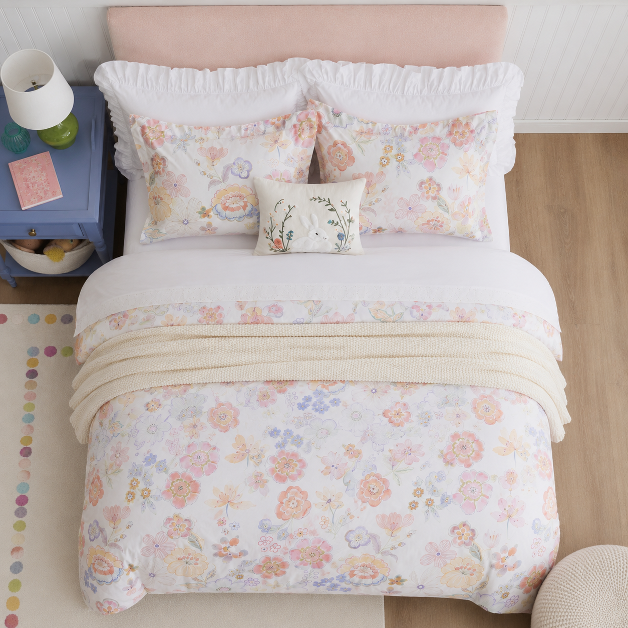 Front straight-on view of a perfectly made bed with the DAUAOTO pastel blossom watercolor floral bedding set.