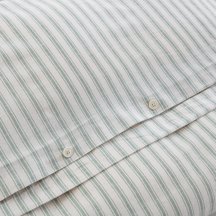 Premium craftsmanship highlighting the discreet hidden button closure on the sage green yarn-dyed stripe duvet - DAUAOTO