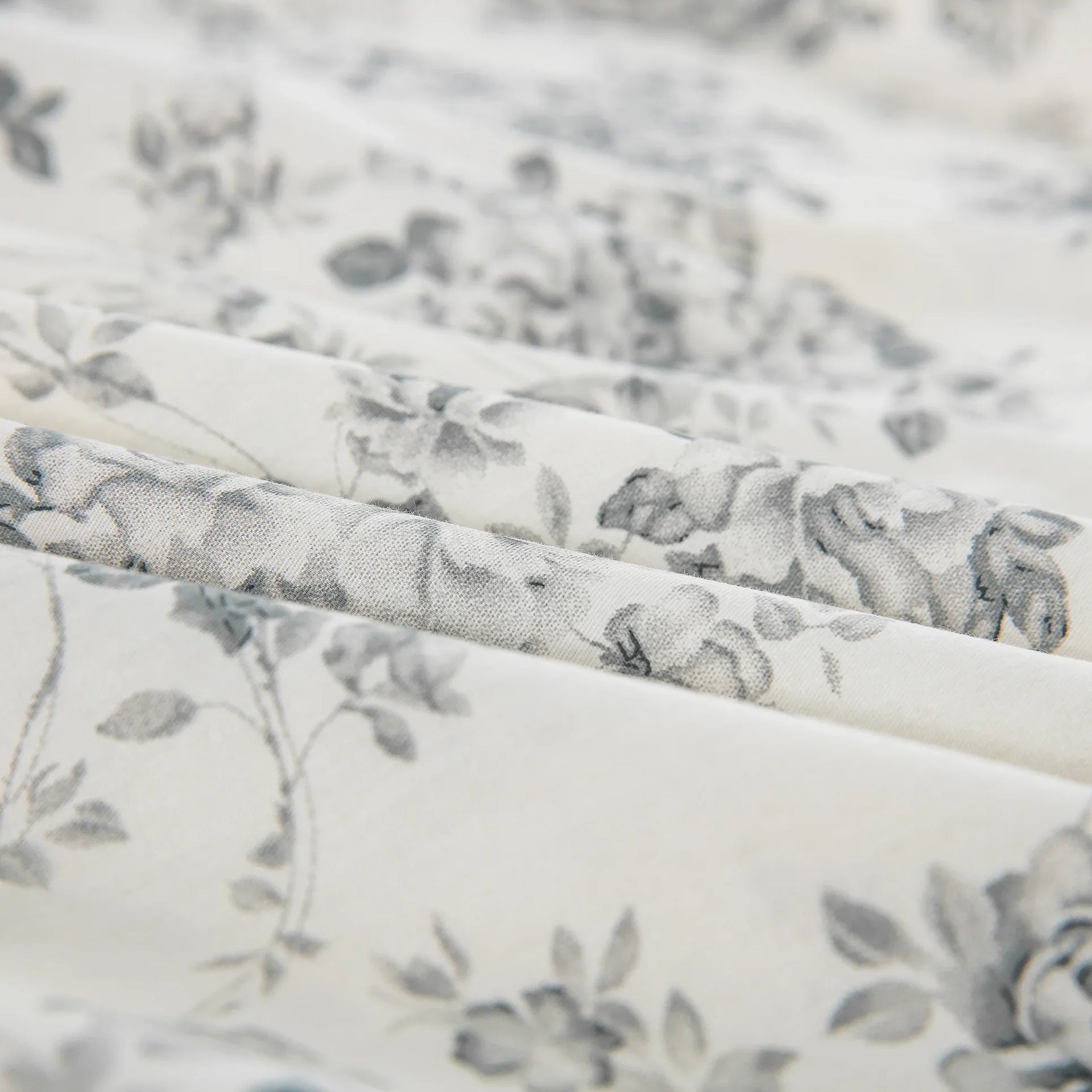 Close-up of the ultra-soft 100% pure cotton fabric showing an intricately drawn gray rose pattern on a crisp light ground - DAUAOTO