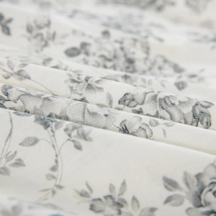 Close-up of the ultra-soft 100% pure cotton fabric showing an intricately drawn gray rose pattern on a crisp light ground - DAUAOTO