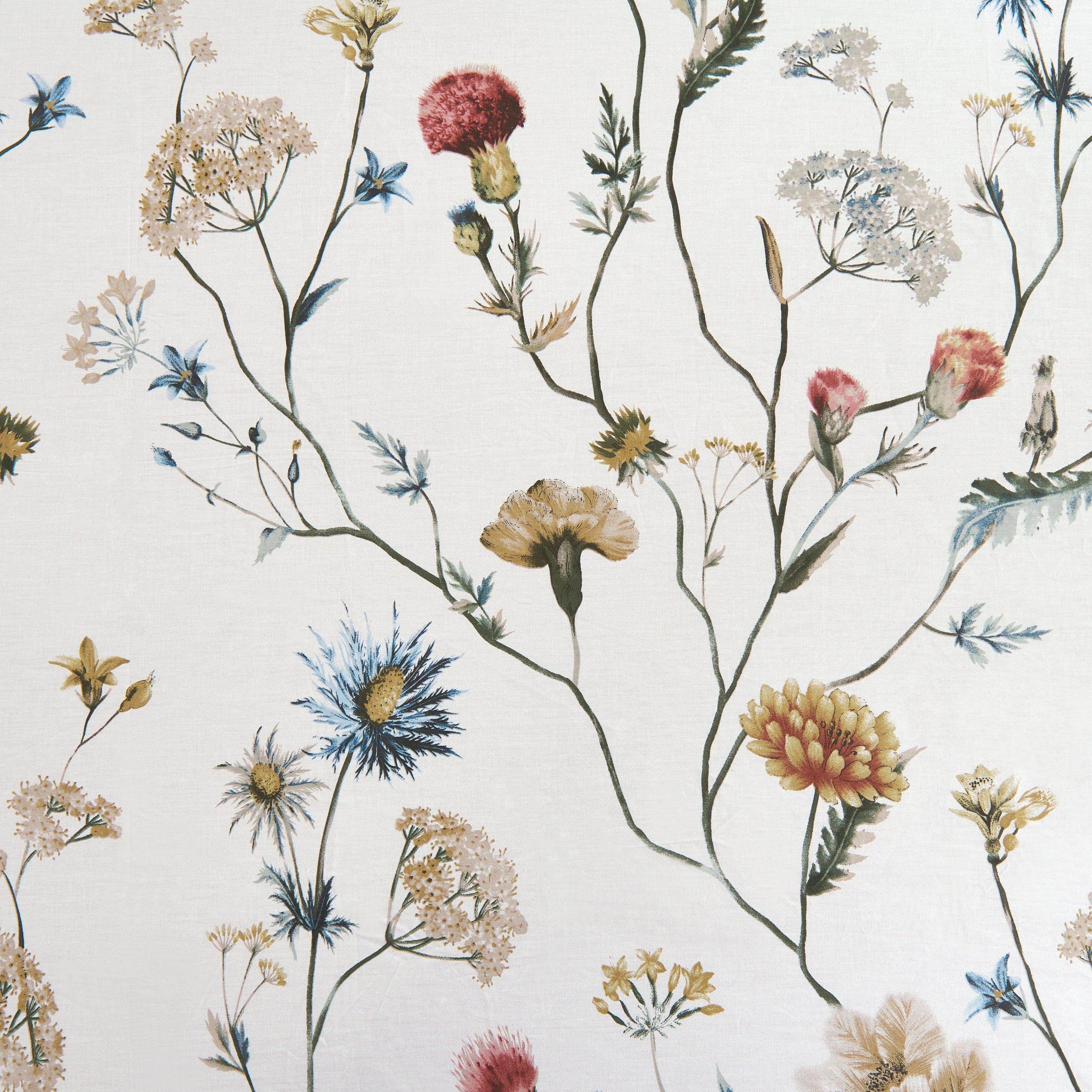 Detailed view of the multi-colored floral garden pattern gently scattered across a warm ivory ground - DAUAOTO