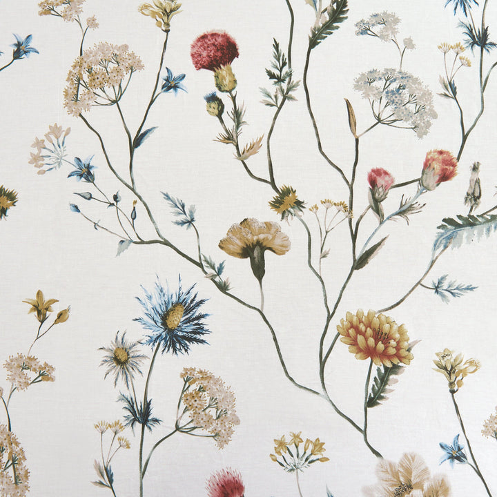 Detailed view of the multi-colored floral garden pattern gently scattered across a warm ivory ground - DAUAOTO