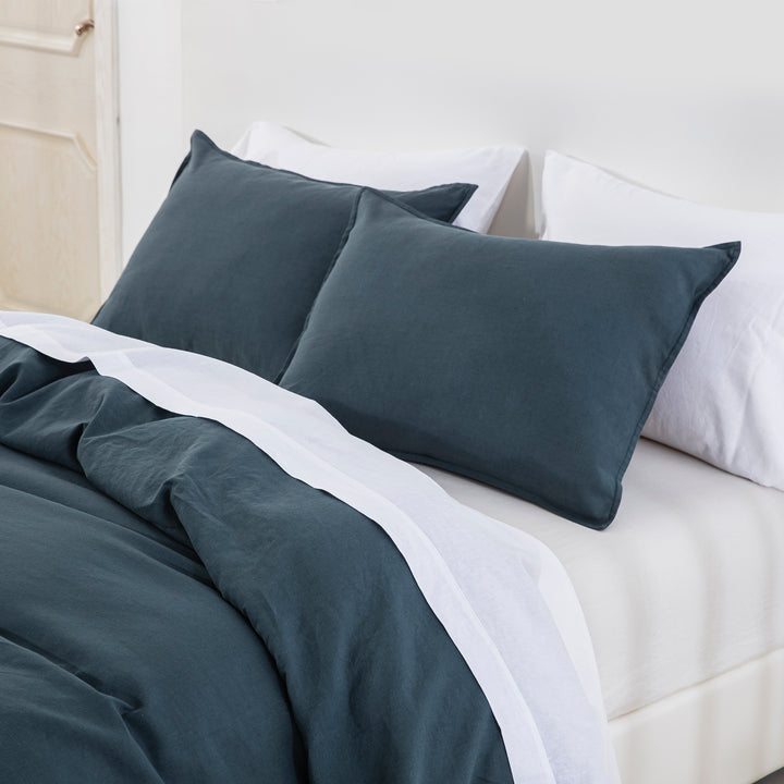 Sophisticated sleep sanctuary with midnight slate blue linen cotton blend layering and modern tranquility - DAUAOTO