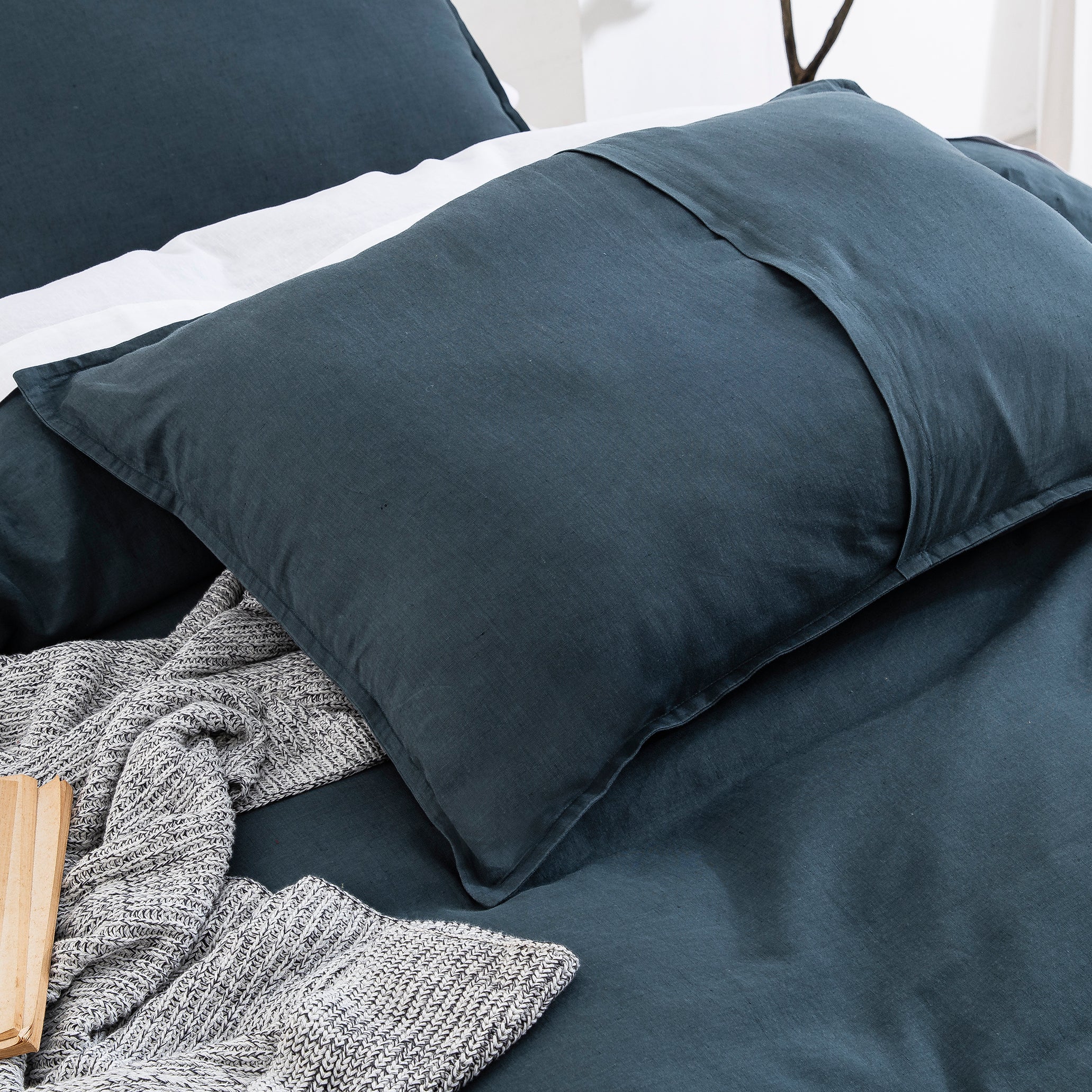 Matching midnight slate blue linen cotton pillow shams with sleek envelope closures and breathable texture - DAUAOTO
