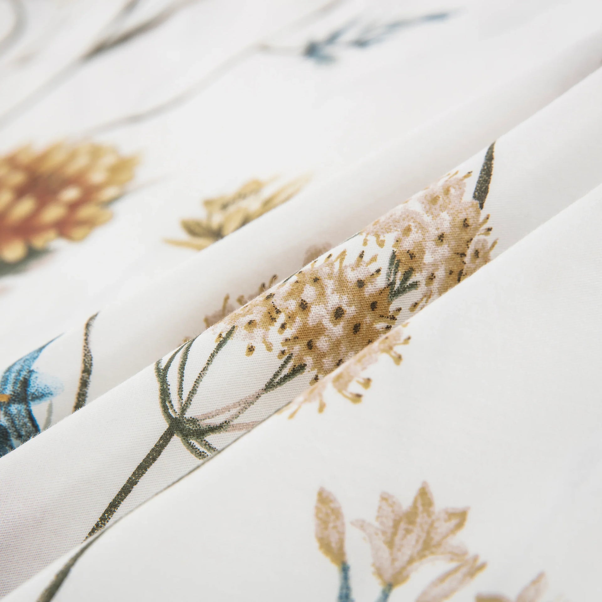 Close-up of ultra-soft 100% pure cotton fabric showing detailed multi-colored botanical florals - DAUAOTO