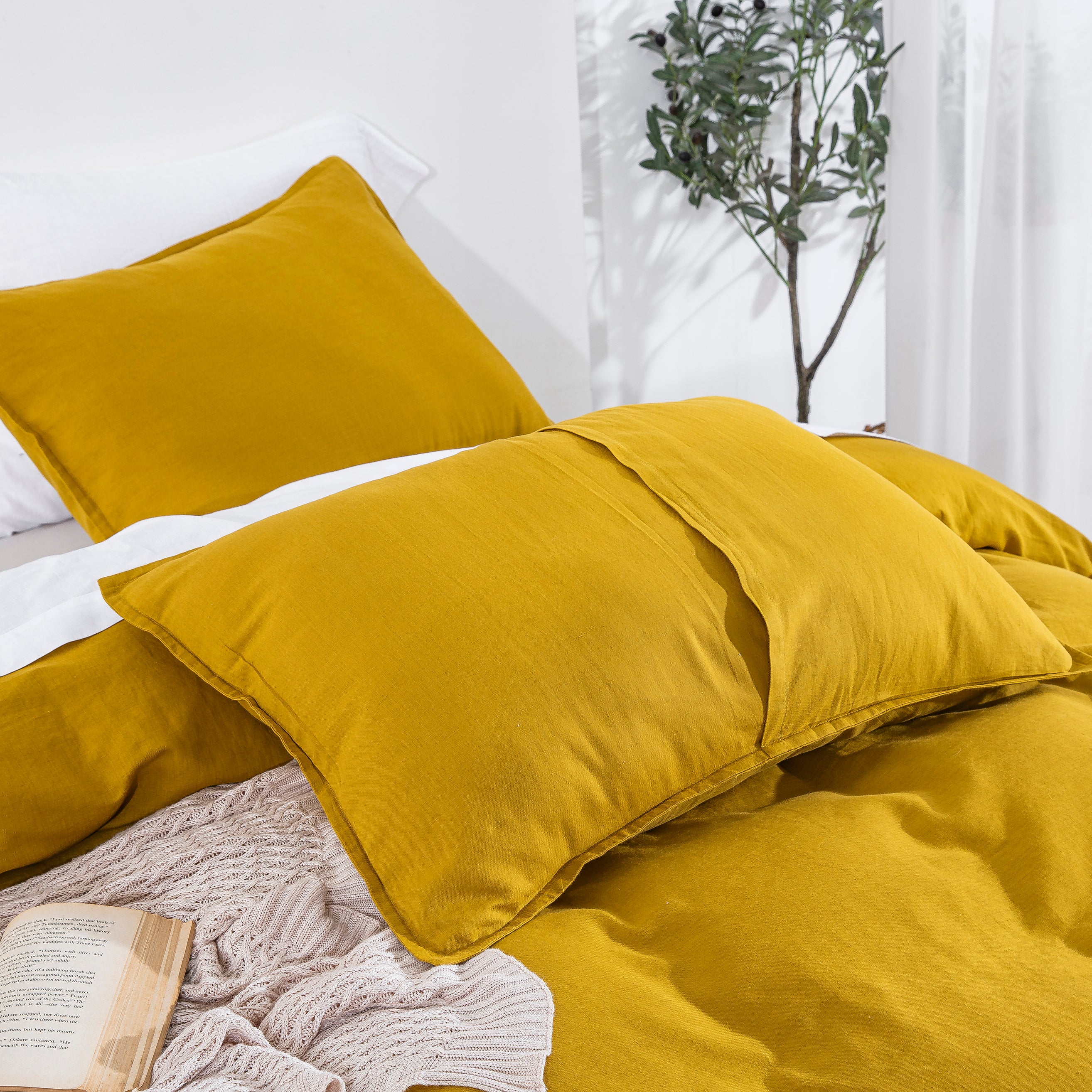 Close-up of mustard yellow linen cotton pillow shams showcasing the breathable rustic texture of linen - DAUAOTO
