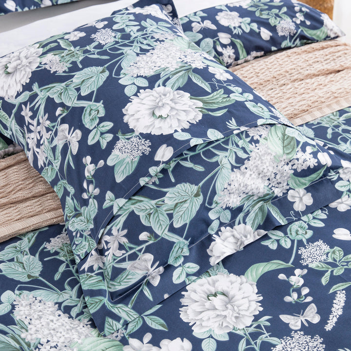 Matching pillow shams with 2-inch decorative flange and envelope closure in navy floral print - DAUAOTO