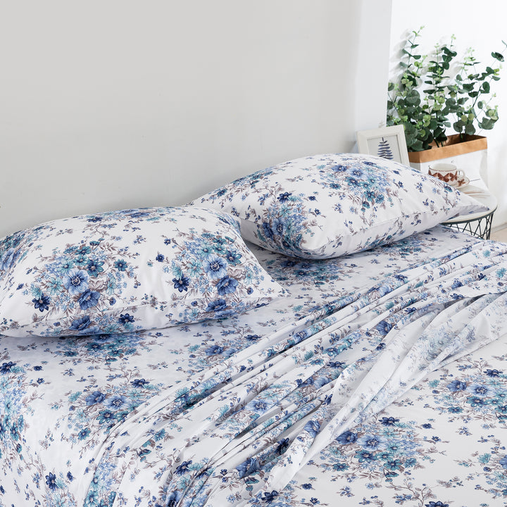 Cozy coastal retreat styled with the soothing blue vintage floral print cotton bed sheets for a tranquil sleep space - DAUAOTO