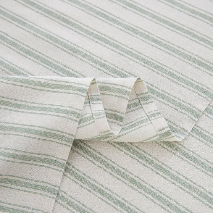 Detailed view of the beautifully draped sage green striped flat sheet highlighting the smooth softness and rustic linen texture - DAUAOTO