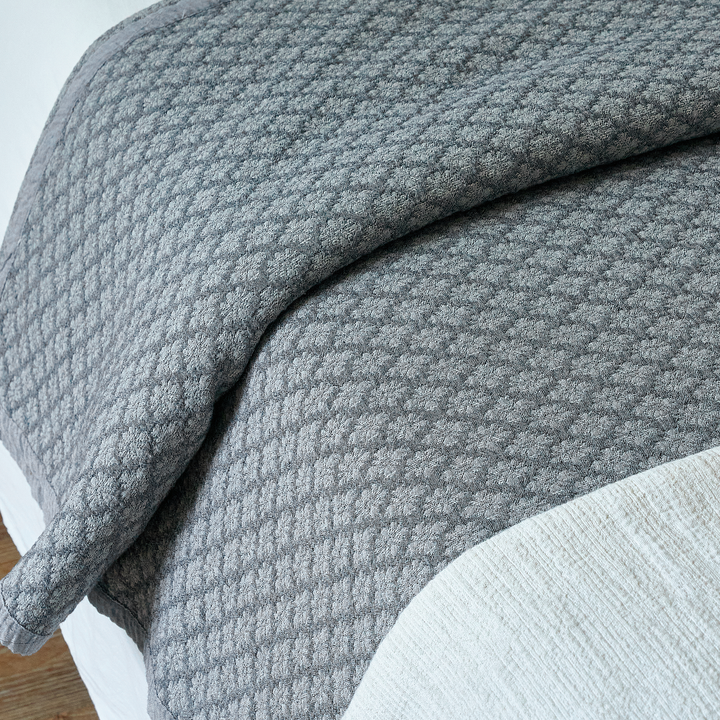Slate blue washed cotton pillow sham featuring a textured diamond jacquard pattern