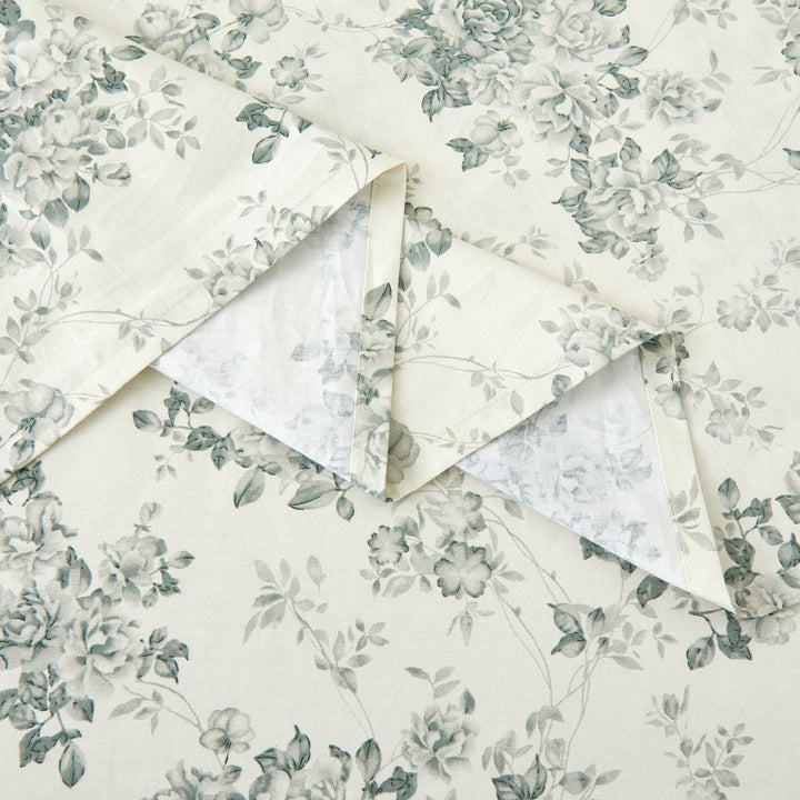 Detailed view of the refined and elegantly draped flat sheet with sophisticated black floral rose print - DAUAOTO